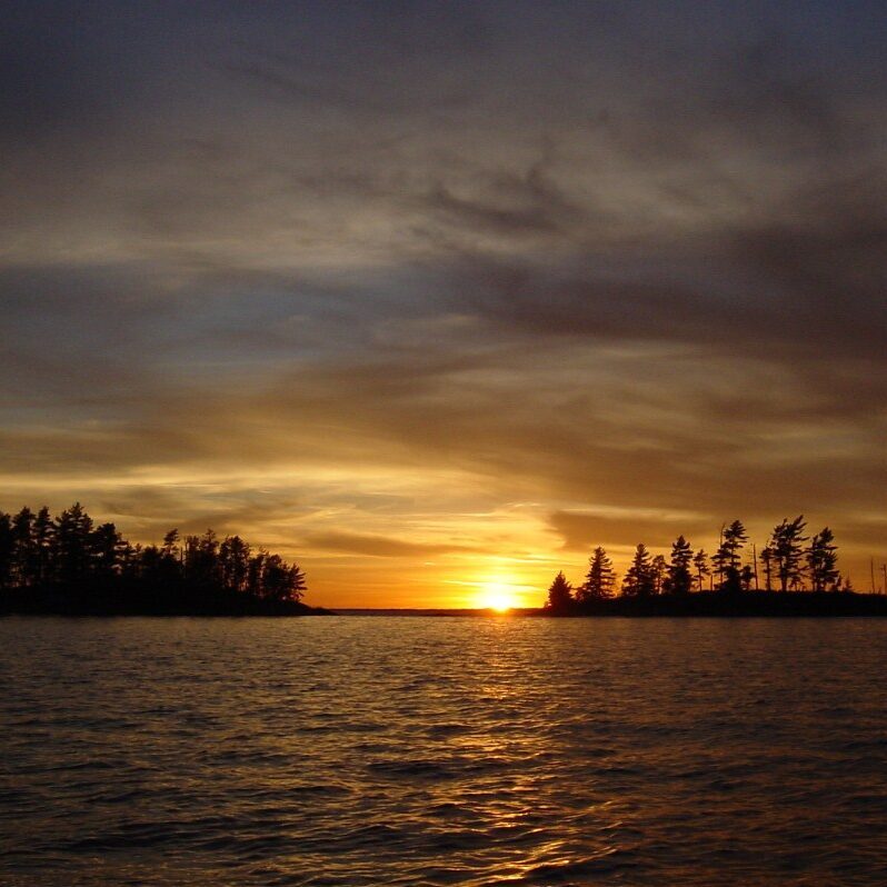 Breathtaking Rainy Lake sunset as seen from a tour boat